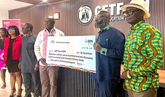 Ebenezer Kwadwo Saka Addo-Mensah (2nd from right), CEO, Saka Homes, presenting the dummy cheque to Paul Adjei (4th from left), Administrator, GETFund. Looking on are Alexis Asuinura (right), Financial Controller, GETFund, and other officials of GETFund. Picture: ERNEST KODZI
