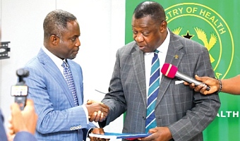 Prof. Agyeman Badu Akosa (right), a former Director- General, Ghana Health Service, and Chairman, Investigation Committee, presenting the report to Kwabena Mintah Akandoh, Minister of Health. Picture: ELVIS NII NOI DOWUONA 