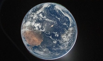 The image, titled Hello, World, shows the Earth as seen from the Orion capsule