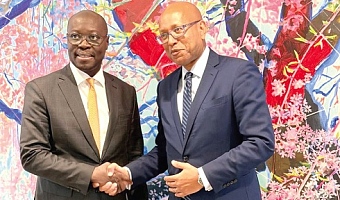 Dr Cassiel Ato Forson (left), Minister of Finance, in a handshake with Ethiopis Tafara, Regional Vice-President for  Africa, International Finance Corporation, after the meeting