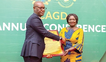 Kwasi Agyei (left), the Controller and Accountant-General, presenting a citation to Vice-President Prof. Naana Jane Opoku-Agyemang for her distinguished  public service