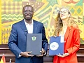 Dr Cassiel Ato Forson (left), Minister of Finance, and Carole van Eyll, Ambassador of Belgium, displaying the agreement
