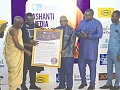 Albert Kwabena Dwumfuor (3rd from left),  President of the GJA, being assisted by Yaw Boadu Ayeboafoh (2nd from left), a former Editor, Daily Graphic, to present a citation to Kofi Badu (3rd from right), the Chief of Staff at the Manhyia Palace. Those applauding include Kofi Adu Domfeh (2nd from right), Ashanti Regional Chairman, GJA Pictures: EMMANUEL BAAH