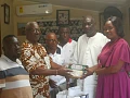 Yvonne Aryee, Snr. Corporate Communications Officer at Graphic Communications Group Ltd, presenting items to Daniel Nii Addy (2nd from left), an elder of the Adabraka Stool. Accompanying them are Tetteh Adjabeng II (2nd from right), the Adabraka Manste, along with some elders of the Adabraka Stool. Picture: ESTHER ADJORKOR ADJEI 