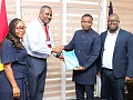 Franklin Sowa (2nd from left), Director, Marketing and Sales, GCGL; presenting the report to Benjamin Avornyotse, acting Director for Communications, International Cooperation and Strategic Partnerships, Cyber Security Authority. Looking on are Linda Aryee (left), Manager, Marketing, Corporate and Investment Banking, Stanbic Bank, and Theophilus Botchway (right), Principal Manager of Law Enforcement Liason Unit, Cyber Security Authority. Picture: ELVIS NII NOI DOWUONA 