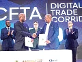 Wamkele Mene (left), Secretary-General, AfCFTA Secretariat, and Philip Gamey (right), Executive Chairman, QUEST Ghana, exchanging the signed agreement. Behind them are Pierre Laporte (middle), Minister for Finance, Economic Planning, Trade and Investment of Seychelles, and other dignitaries