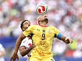 Ghana’s Jordan Ayew wins an aerial battle against Reece James of England during yesterday’s game