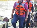 Emmanuel Armah Kofi Buah (front) with some military personnel on a tour of River Ankobra River to combat illegal mining