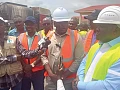Kwame Governs Agbodza (middle), Minister of Roads and Highways, speaking to the media after inspecting the ongoing road construction leading to the Sewua Hospital. Looking on is Dr Frank Amoakohene (right), Ashanti Regional Minister