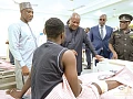President John Dramani Mahama (3rd from right) in a chat with an injured officer admitted to the new block during the ceremony