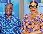 Alex Apau Dadey (left), Chairman, KGL Group, with Helga Boadi, Executive Director, GNPC Foundation