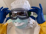The Ebola virus spreads through contact with infected bodily fluids such as blood or vomit