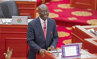 Dr Cassiel Ato Forson,  Minister of Finance,  presenting the Mid-Year Fiscal Policy Review in Parliament