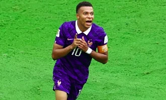 Kylian Mbappe celebrates scoring his second and France's third goal