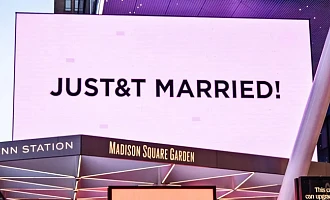 Madison Square Garden lit up a pinkish lavender colour and displayed multiple signs after the couple were wed inside