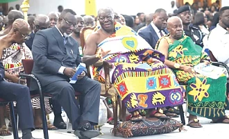 Otumfuo Osei Tutu II, the Asantehene, interacting with Justice Paul Baffoe-Bonnie (left), the Chief Justice, during the 150th anniversary lecture of the Supreme Court of Ghana. Looking on is Ogyeahoho Yaw Gyebi II (right), President, National House of Chiefs