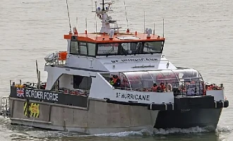 Border Force pictured escorting migrants to the UK after being rescued in the Channel in March