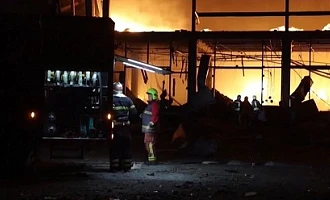 Firefighters battle huge flames in Kyiv region after Russian strikes