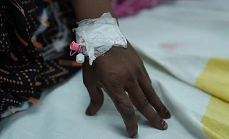 The mother of four young children was attacked in her own home and gang-raped by a group of men
