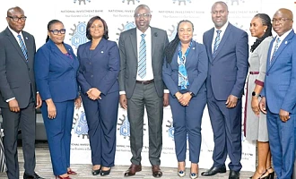 Chief Doli-Wura Zakaria (4th from left), MD, NIB, Belinda Boamah (3rd from left), Deputy MD, Business and Operations, and Thomas Hughes Amissah (3rd from right), Deputy MD, Support Services. With them are Mohamed Gausu (right), Chief Finance Officer, Osman Soale Atchulo (left), Chief Treasury Officer, and other key management staff