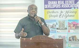 Dr James Condua Orleans-Lindsay (right), President, Ghana Real Estate Developers Association, addressing the meeting. Picture: ERNEST KODZI