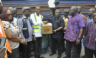 James Gunu (third, right), Volta Regional Minister, receiving the items from Paschal Agbagba, Volta Regional Director of NADMO while some DCEs look on