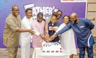 Theophilus Yartey (left), Editor, Graphic, and Doreen Hammond (middle), Editor, The Mirror, assisting the fathers to cut the ceremonial cake. With them include Wasim Deen Ahmed (right), Sales Manager, Japan Motors Trading Co. Ltd, and Paul Kofi Mantey (2nd from left), Managing Director, EDC Investment Ltd.  Pictures: ELVIS NII NOI DOWUONA