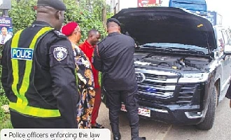 Police officers enforcing the law against the unauthorised use of sirens during a recent operation