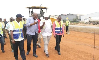 Alhaji Ali Seidu (2nd from left), the Founder of Maripoma Enterprise Limited, taking  Governs Kwame Agbodza (2nd from right), Minister of Roads and Highways, his deputy, Alhassan Sayibu Suhuyini (left), and other dignitaries round to inspect the progress of work on the Accra-Tema Motorway project. Picture: Nana Konadu Agyeman