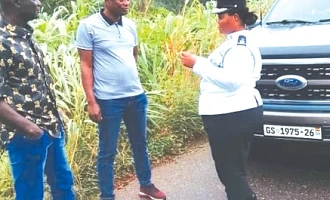 Chief Superintendent Benedicta Akpene Ansah, Volta Regional MTTD Commander explaining a point to two occupants of vehicles intercepted during the exercise