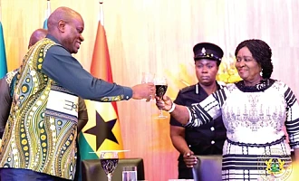 Vice-President Naana Jane Opoku-Agyemang (right) and Brice Clotaire Oligui Nguema, President of Gabon, proposing a toast at the dinner