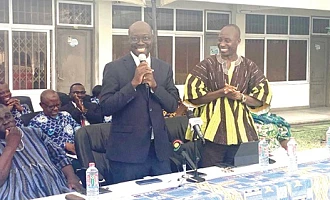 Dr Cassiel Ato Baah Forson (middle), Minister of Finance, addressing staff of the Ghana Statistical Service, as Dr Alhassan Iddrisu (right), Government Statistician, looks on