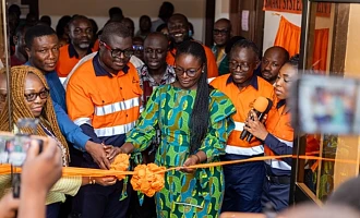 AngloGold Ashanti Iduapriem Mine Managing Director, Mr Daniel Boadi (left), and the Pro-Vice-Chancellor of the University of Mines and Technology (UMaT), Professor Grace Ofori-Sarpong Akuffo, cut the ceremonial tape to officially commission the AngloGold Ashanti Iduapriem Smart Systems Centre