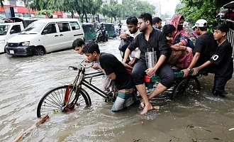 The water has reached knee level in some parts of Dhaka