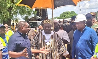 Kwame Governs Agbodza (left), Minister of Roads and Highways, briefing President John Mahama while Pe Ditundini Adiali Ayagitam III (middle), the President of the Upper East Regional House of Chiefs, looks on during the inspection of the Chuchuliga-Sandema road