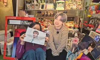 Yeon-su, pictured here at a BTS-themed café in Seoul, had not heard South Korean music before leaving her country