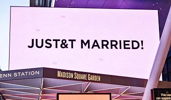 Madison Square Garden lit up a pinkish lavender colour and displayed multiple signs after the couple were wed inside