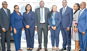 Chief Doli-Wura Zakaria (4th from left), MD, NIB, Belinda Boamah (3rd from left), Deputy MD, Business and Operations, and Thomas Hughes Amissah (3rd from right), Deputy MD, Support Services. With them are Mohamed Gausu (right), Chief Finance Officer, Osman Soale Atchulo (left), Chief Treasury Officer, and other key management staff