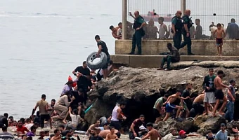 Spainish enclave Ceuta raises alarm as thousands cross border from Morocco