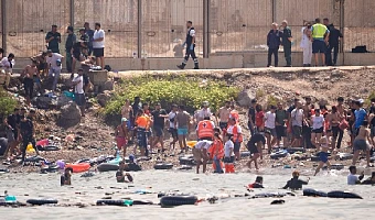 Nine dead as thousands of migrants enter Spanish enclave from Morocco