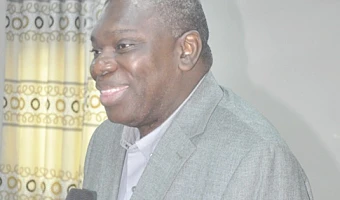 Michael Harry Yamson (left), Administrator of the District Assemblies Common Fund, addressing the meeting