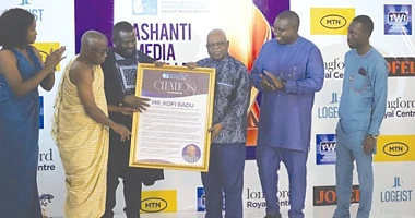 Albert Kwabena Dwumfuor (3rd from left),  President of the GJA, being assisted by Yaw Boadu Ayeboafoh (2nd from left), a former Editor, Daily Graphic, to present a citation to Kofi Badu (3rd from right), the Chief of Staff at the Manhyia Palace. Those applauding include Kofi Adu Domfeh (2nd from right), Ashanti Regional Chairman, GJA Pictures: EMMANUEL BAAH