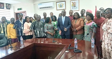 Haruna Iddrisu (arrowed), Minister of Education, assisted by Dr Clement Apaak (behind), Deputy Minister of Education, with some heads of Special Schools and some members of the disability community