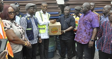 James Gunu (third, right), Volta Regional Minister, receiving the items from Paschal Agbagba, Volta Regional Director of NADMO while some DCEs look on