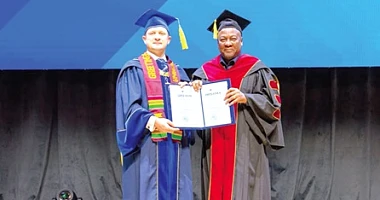 President John Dramani Mahama (right), with his honorary doctorate from the Peoples' Friendship University of Russia (RUDN) in Moscow